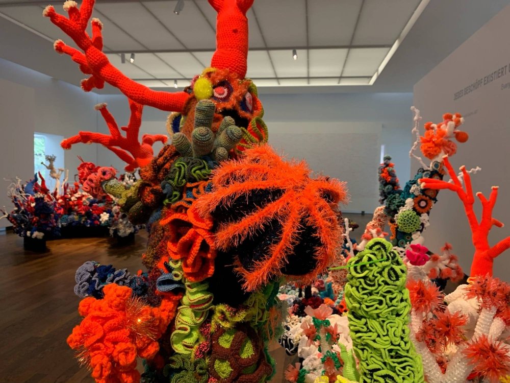 A colorful coral reef made out of wool to raise awareness about climate change, at a museum in Baden-Baden, Germany, in January 2022 | REUTERS